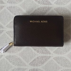 Michal Kors small zip wallet.